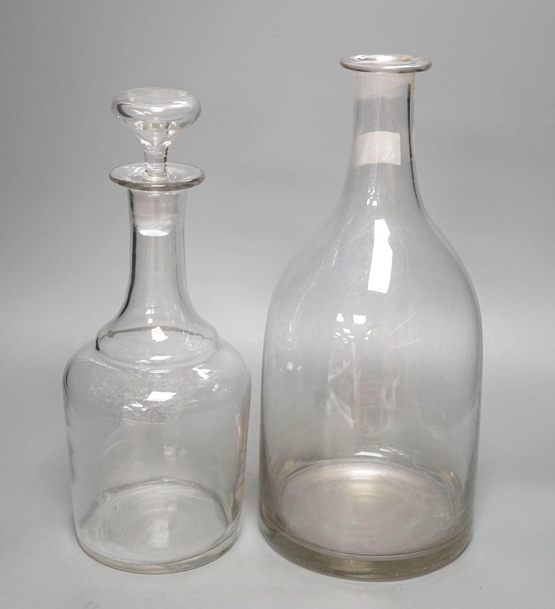 Two Normandy glass cider carafes, tallest 38cm